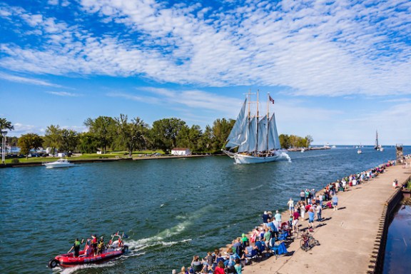 a group of people in a boat on a body of water
